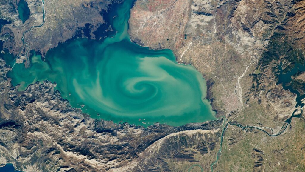 Stunning Milky Whirlpool Spotted Over Southern Europe’s ‘Gloomy’ Lake — A Space Perspective