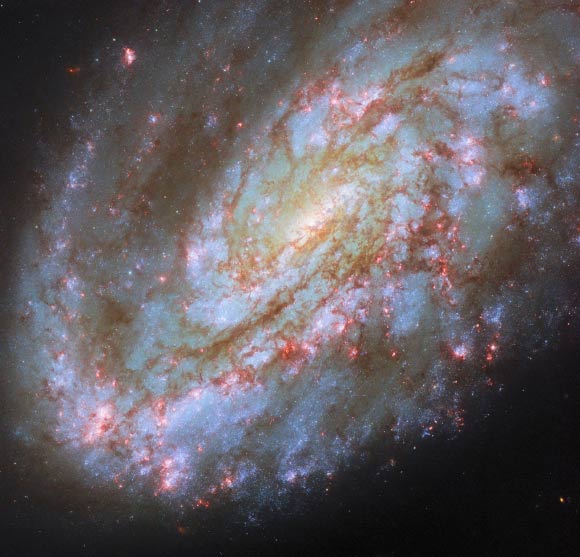 Hubble Telescope Captures a Spiral Galaxy Warped by Cosmic Forces