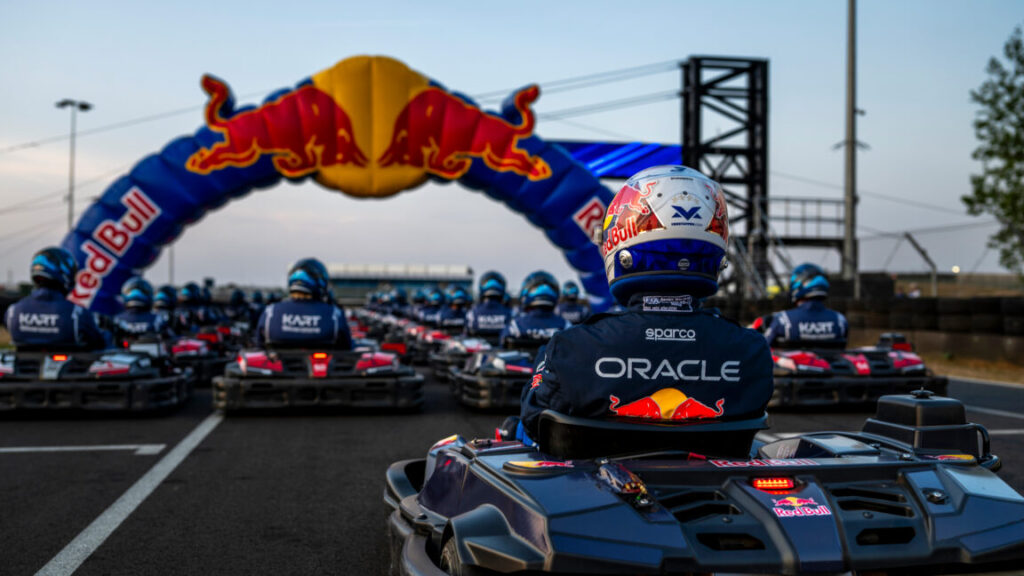 World’s Best Racing Driver Takes on 100 Karts at Once